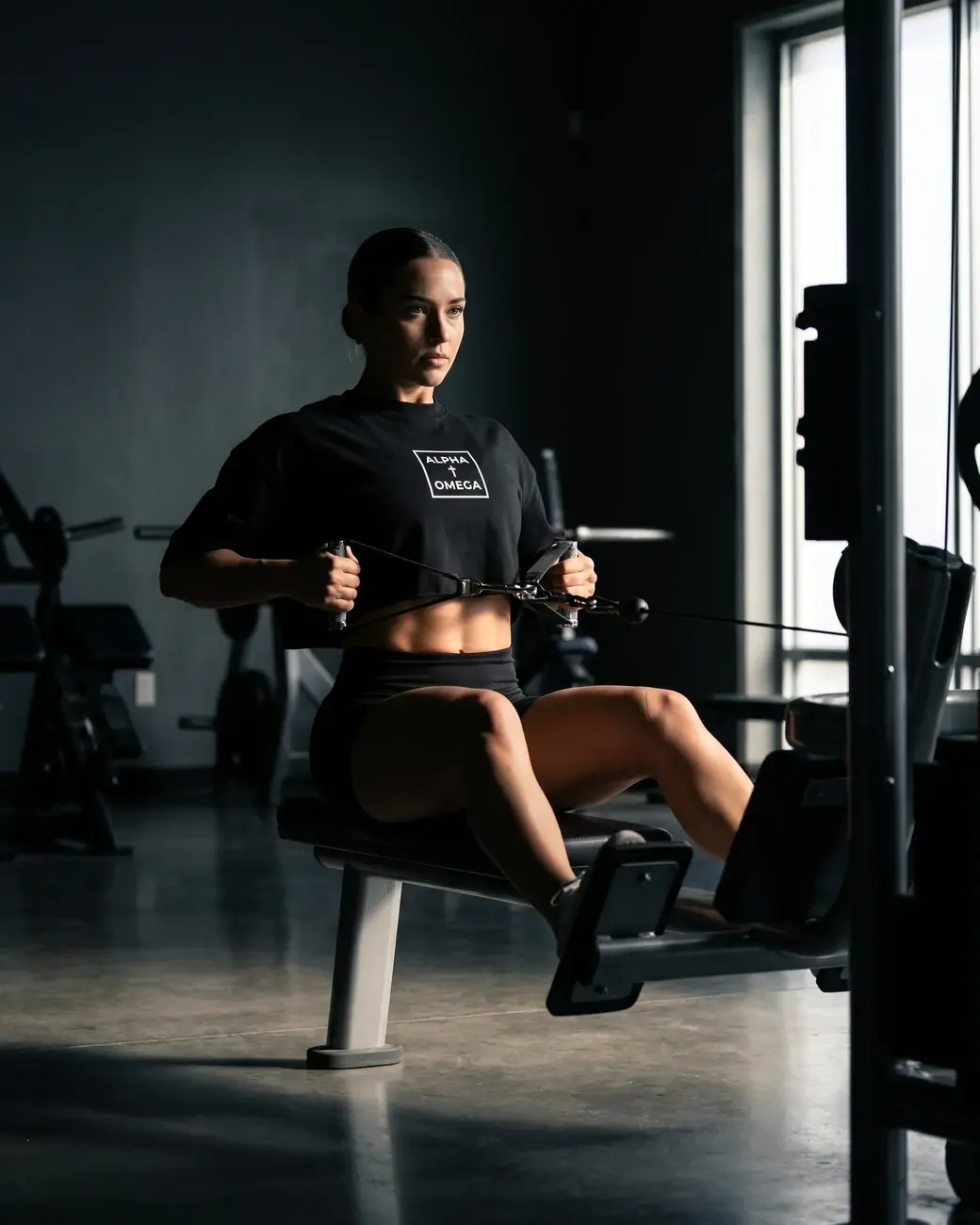 Model wearing the AO Cornerstone Crop in black, front view